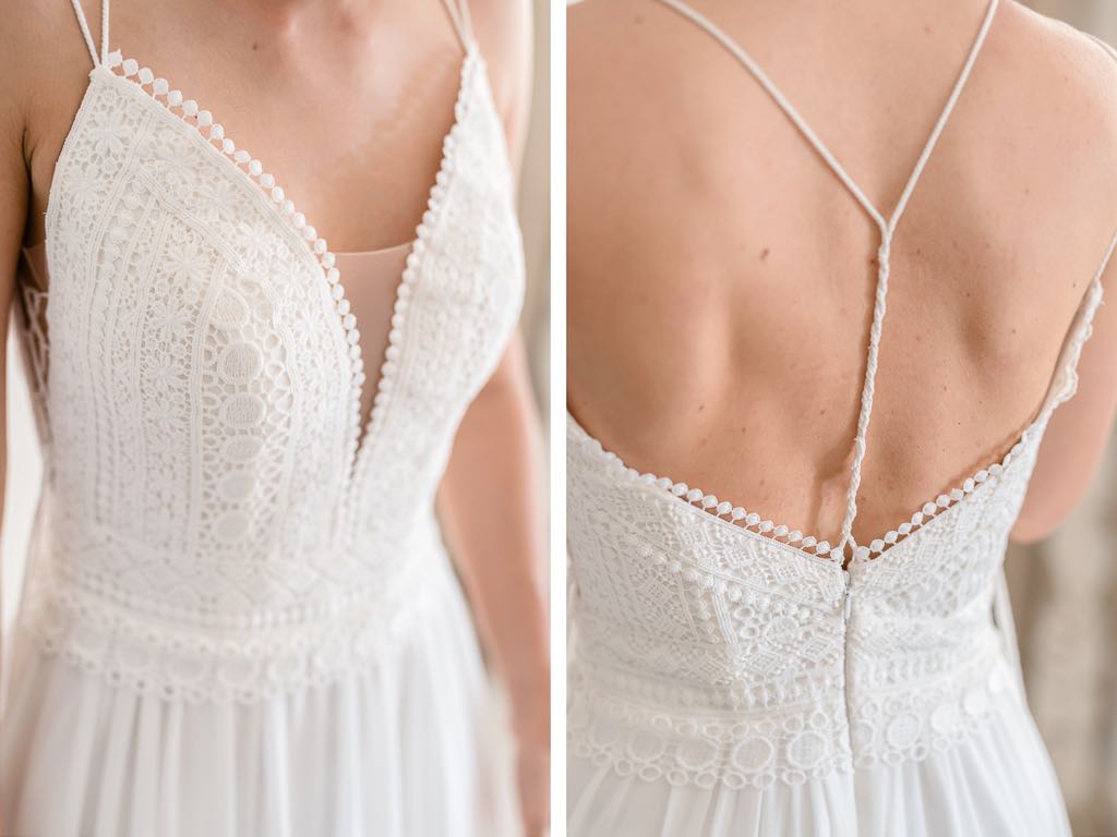 i dettagli dei ricami dell'abito da sposa